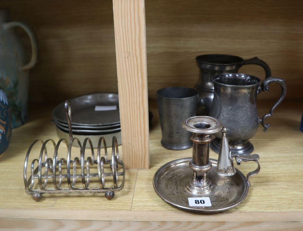 A Victorian silver plated chamberstick, pewter tankards, plates and a toast rack